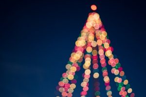 holiday lights displayed in the shape of a christmas tree.