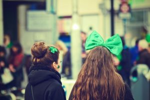 girls wearing festive green st. paddy's day bows and hair ties.